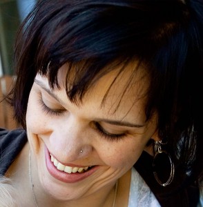 Deanna smiling, looking down